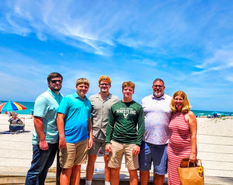 Andy and Esta Ryder with family on Venice Beach, Florida — founders of Coastal Calm Home Watch